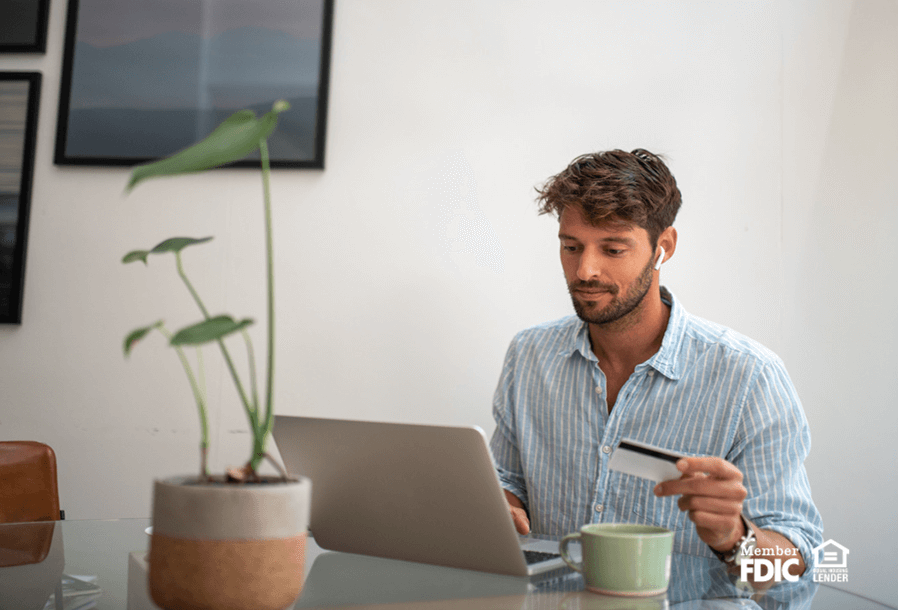 a man checks his credit score online