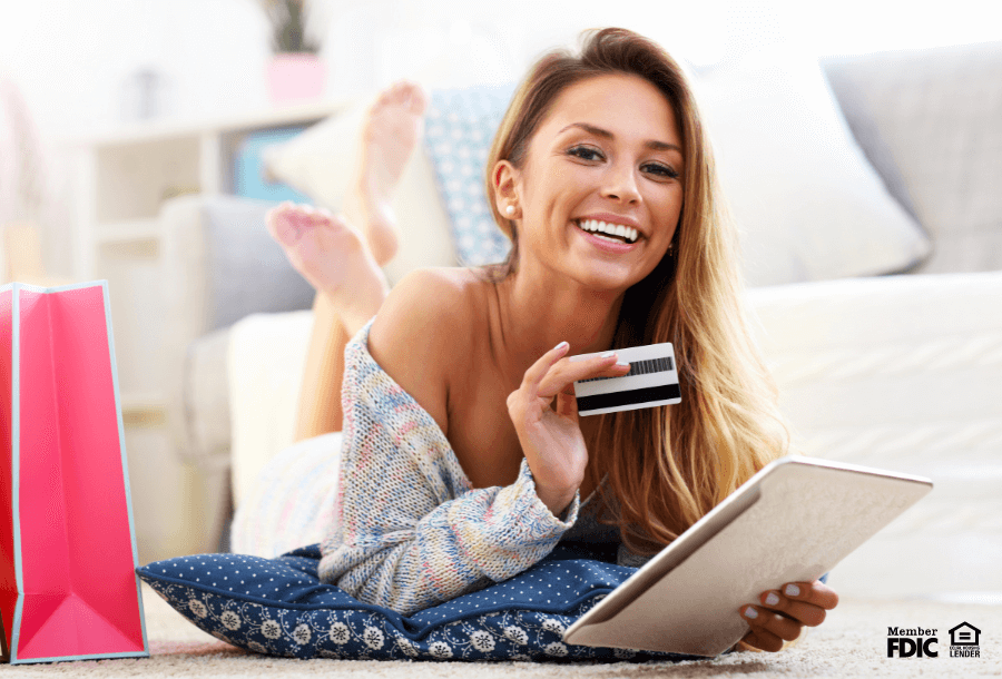 a woman checks her secured credit card balance through online banking