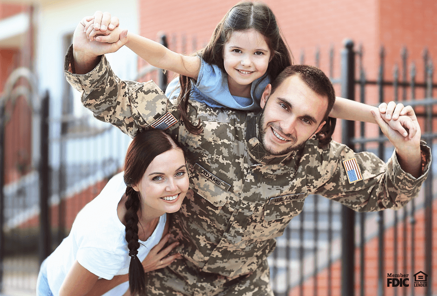 an active military member poses with his family