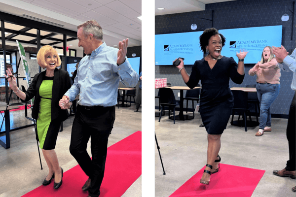 employees celebrate the first day at the new offices with a red carpet walk moment