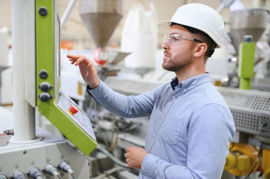 supervisor checking the assembly line specifications on a monitor
