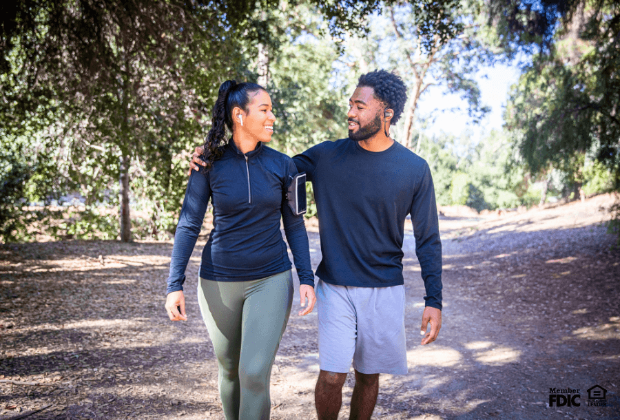 a couple goes for a walk in the woods in Colorado Springs