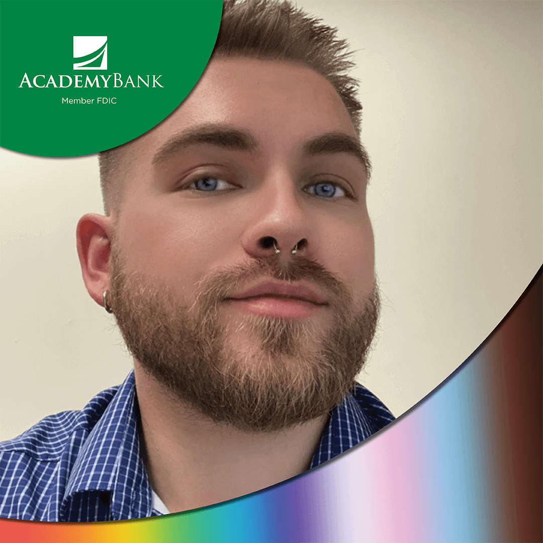 an LGBTQ+ employee smiles for the camera for Pride month