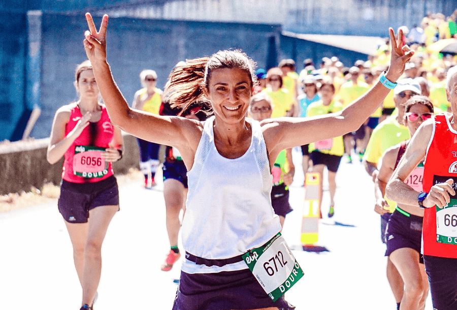 Elated marathon runner who has successfully repaired her credit.