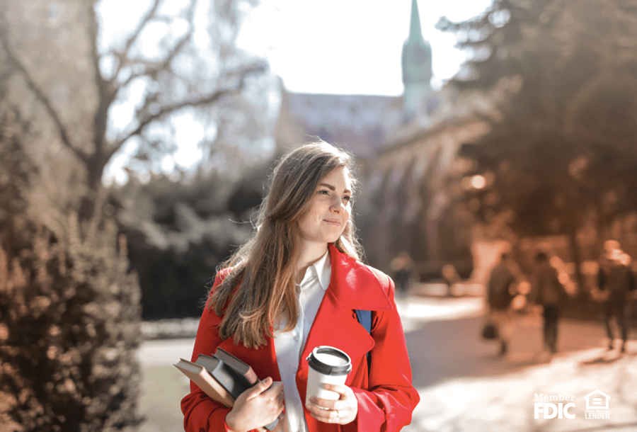 a student walks to class on a college campus