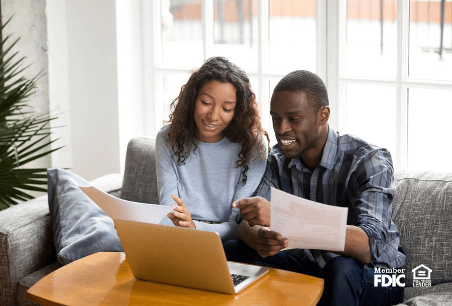 a man and woman go over financial resolutions statements together