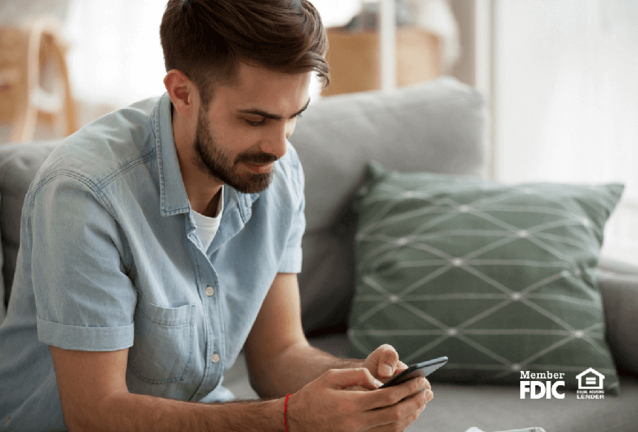 a man checks his online banking with his mobile app