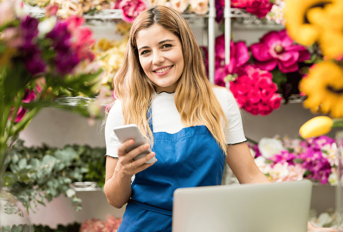 Flower shop owner, benefitting from the best business loan for seasonal cash flow: a business line of credit.