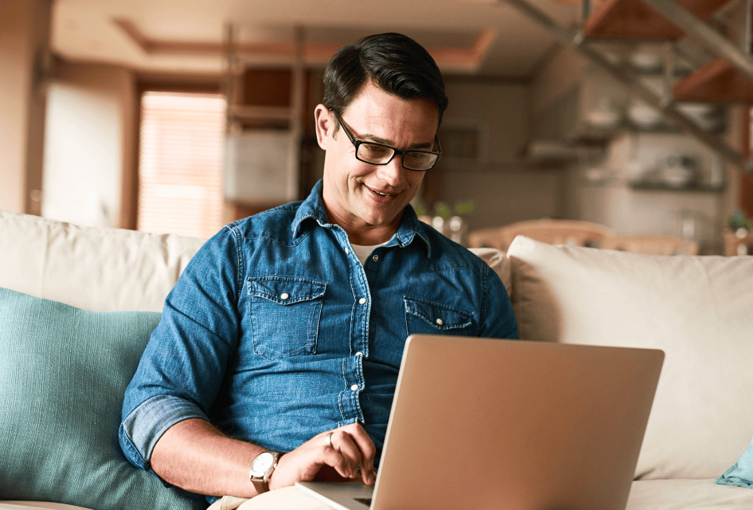 Man pulling his free Experian credit report online.