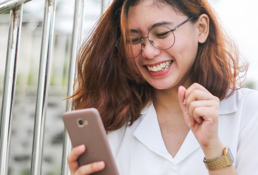 person using phone to access the online banking app