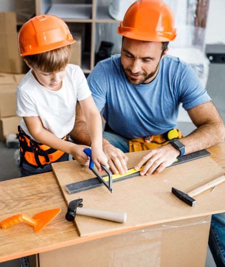 A father and son work on a home improvement project together