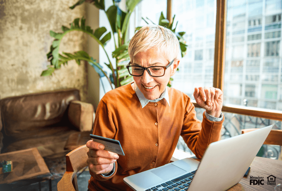 a woman checks her credit score online through online banking