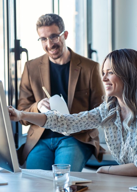 two coworkers team up on a business project at work