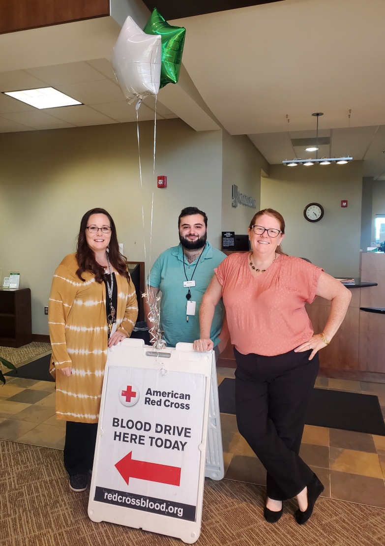 Academy Bank employees participate a blood drive