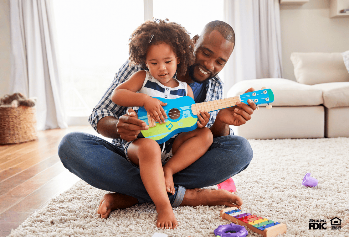 Father with his kid at the home he bought with a conforming or non conforming loan.