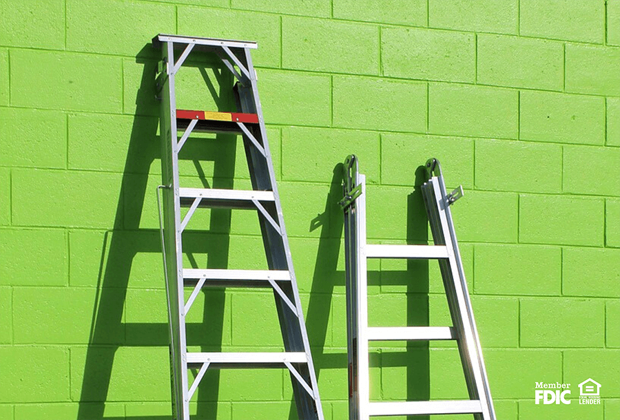 two ladders leaning up against a wall representing CD ladders