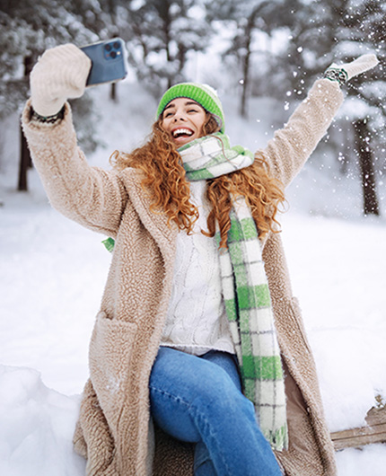 girl taking a selfie in the snow