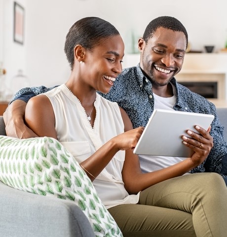 a couple looks over their retirement funding accounts online