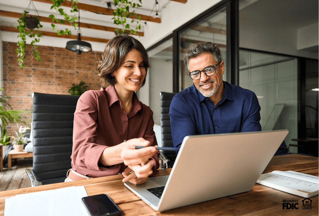 Commercial banking partners discussing lending solutions.