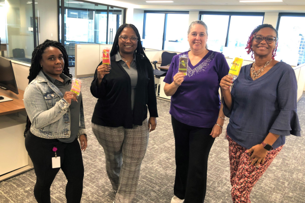 Academy Bank employees enjoy complimentary popsicles to celebrate day 2 at the new office