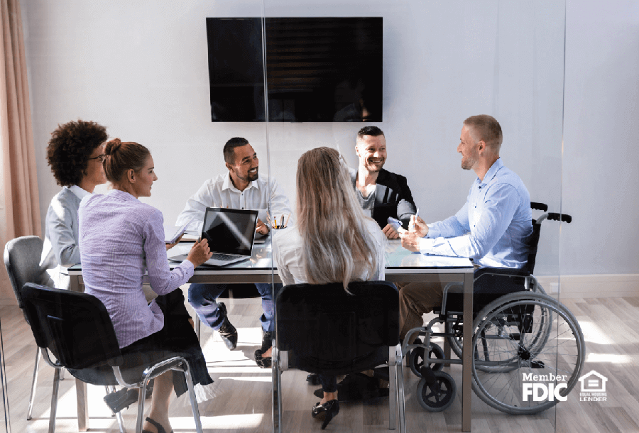 a diverse group of coworkers participate in a meeting about a project