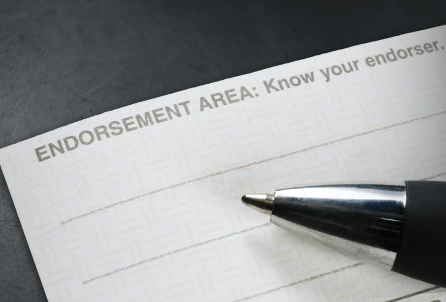 Area on the back of a check where endorsing happens for banking.