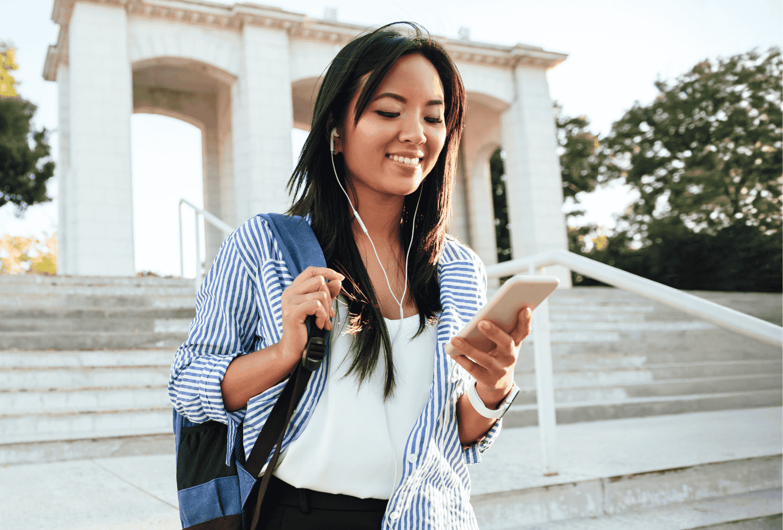 College student using mobile banking for her student checking account.