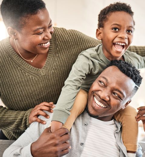 a family is all smiles while playing together