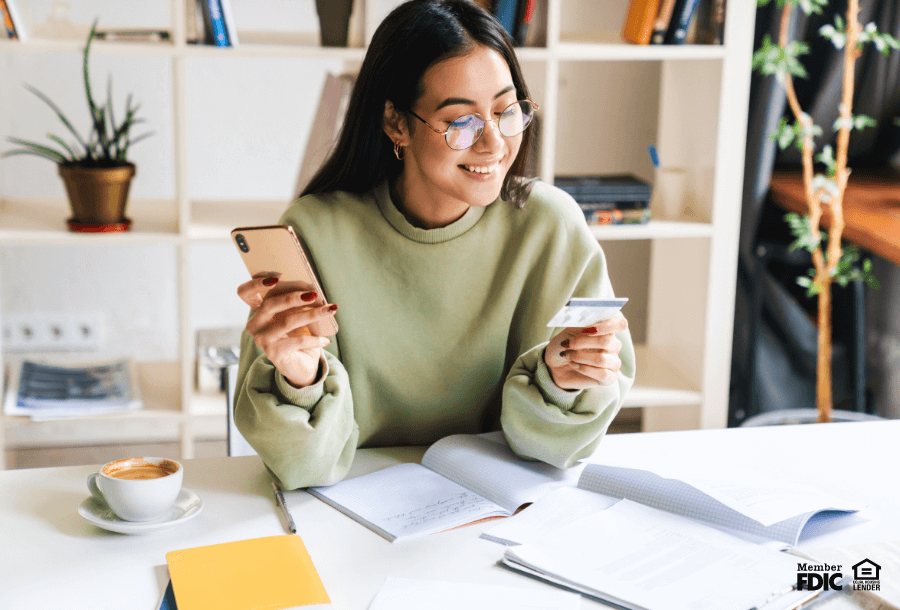 a student buys books with her credit builder credit card