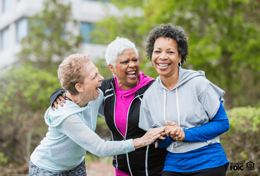 a group of middle-aged females enjoy working out outside together