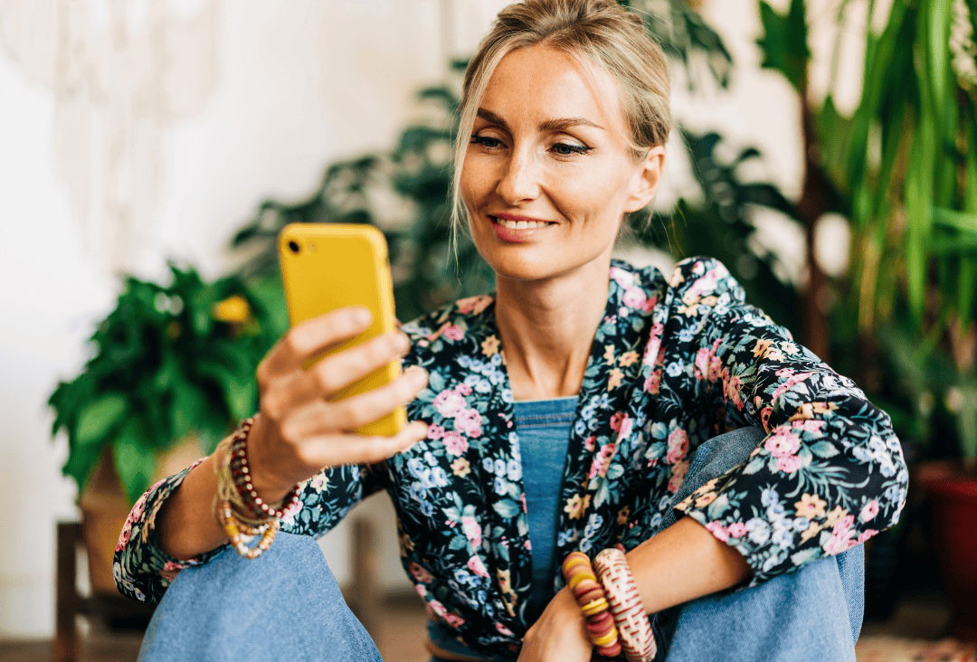 Woman using digital banking to manage her high interest checking account earnings
