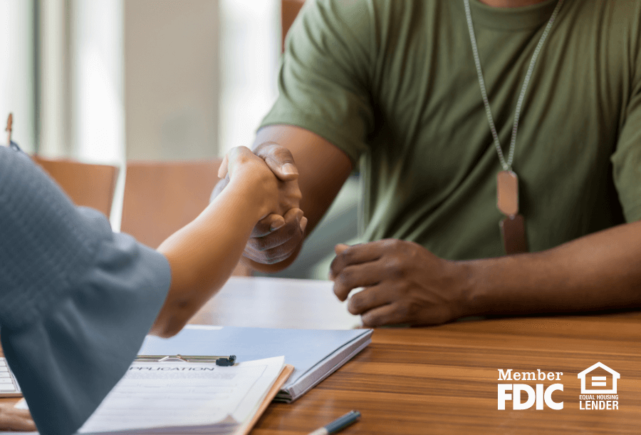 two people shake hands after finishing a VA loan deal