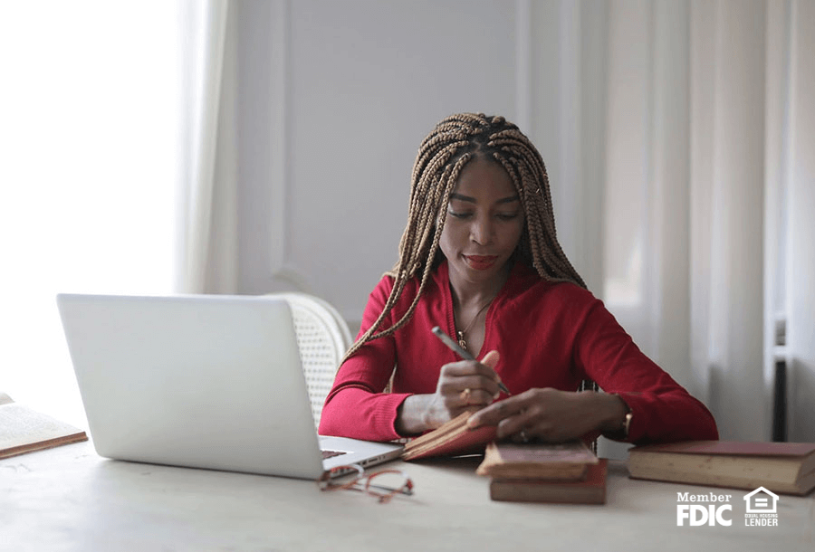 a woman checks her budget and money saving through online banking