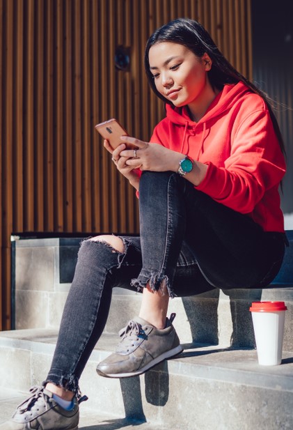 a woman on her cell phone looking at online banking