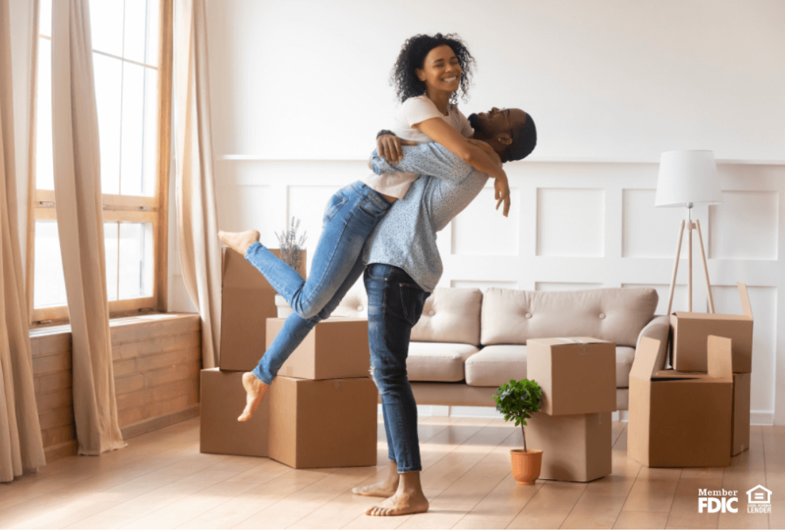 A young couple celebrate their new home.
