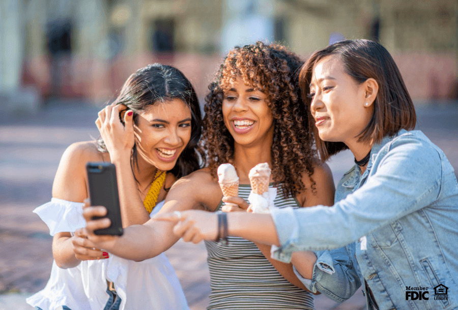 a group of friends take a selfie with ice cream cones