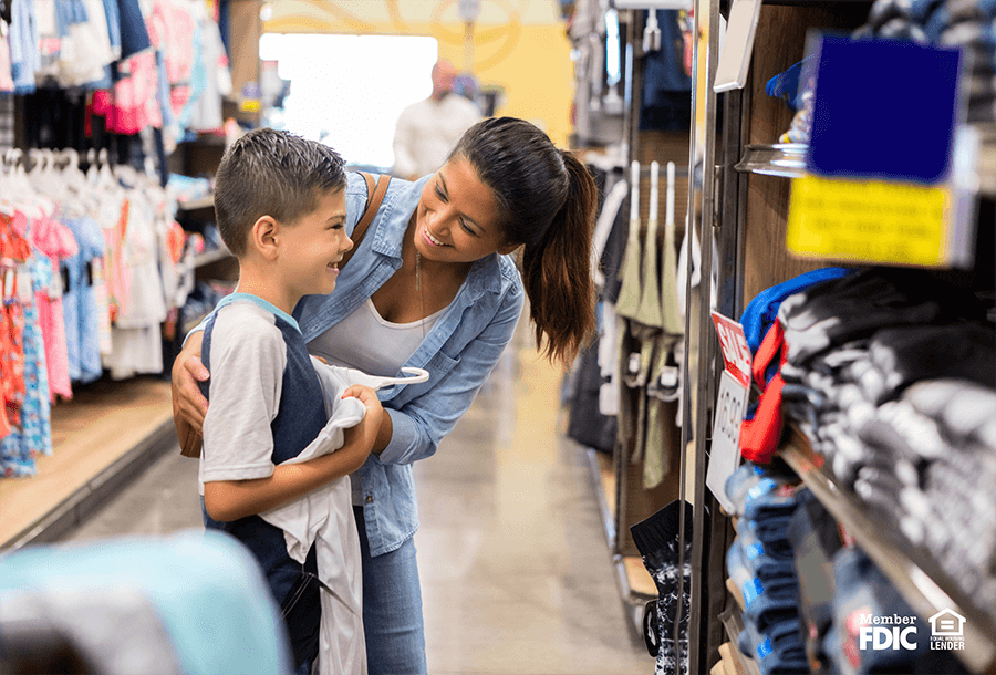 a mother and son go back to school shopping