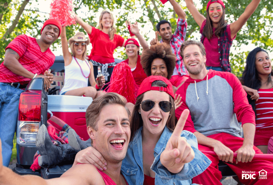 Friends tailgating together, enjoying the benefits of checking accounts in Kansas City.