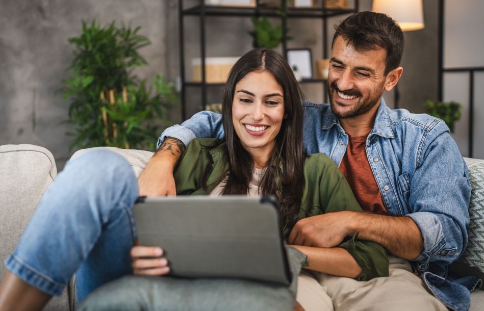 couple reviewing information on a tablet