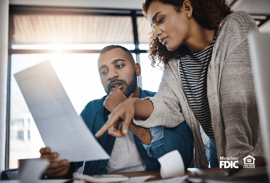 a woman explains certificates of deposit and bonds to a man