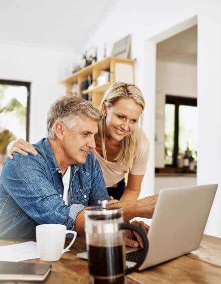 a couple goes over their funds in online banking