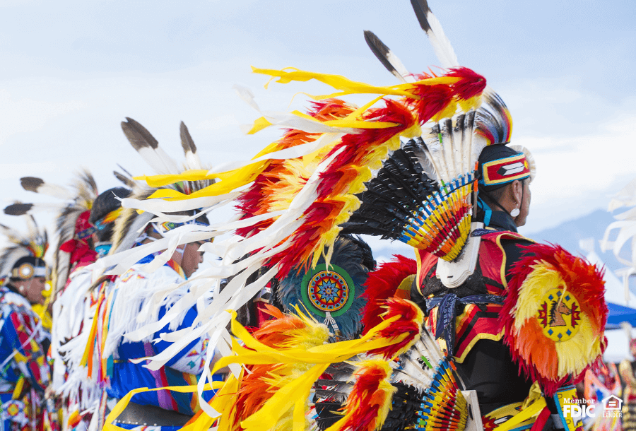 Native Americans dressed in cultural clothing together