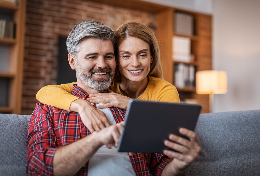 a couple fills out a personal loan application online