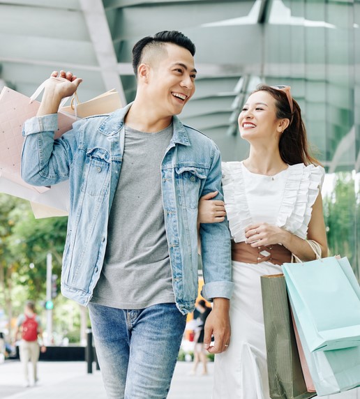 a happy man and woman share a day out shopping