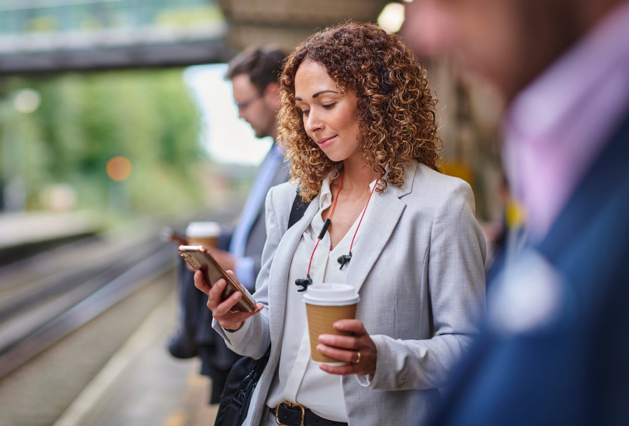 a woman using phone to use online banking