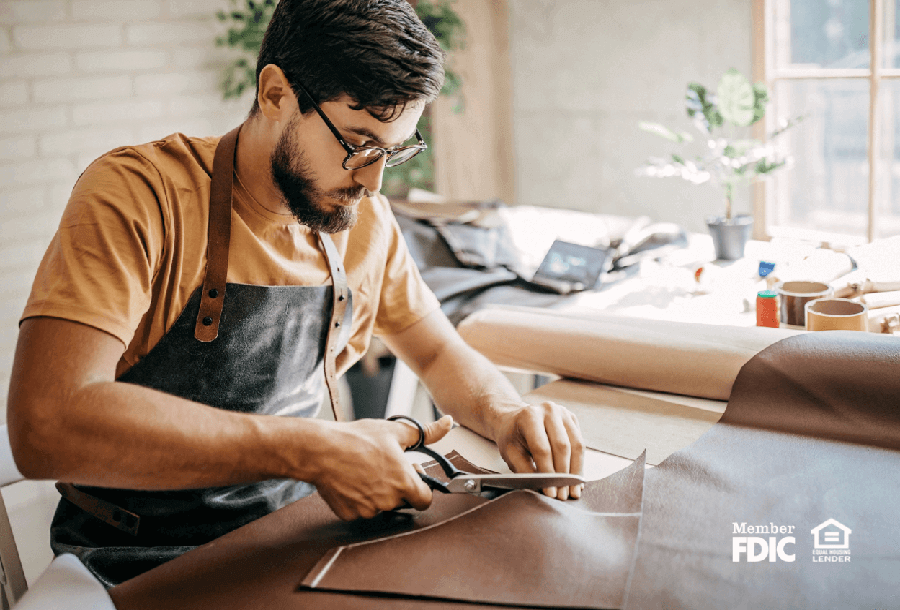 a young man works confidently at his business 