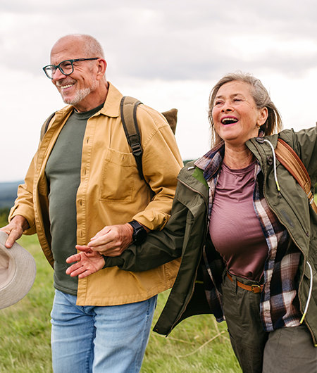 a man and woman enjoying a walk outside