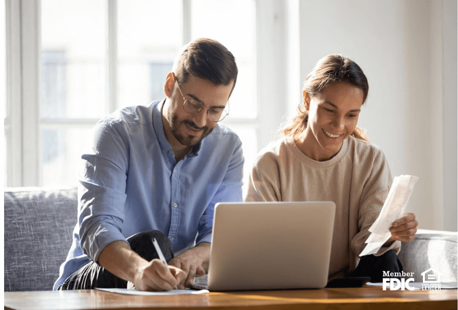 a man and woman go over their accounts together to manage cash flow